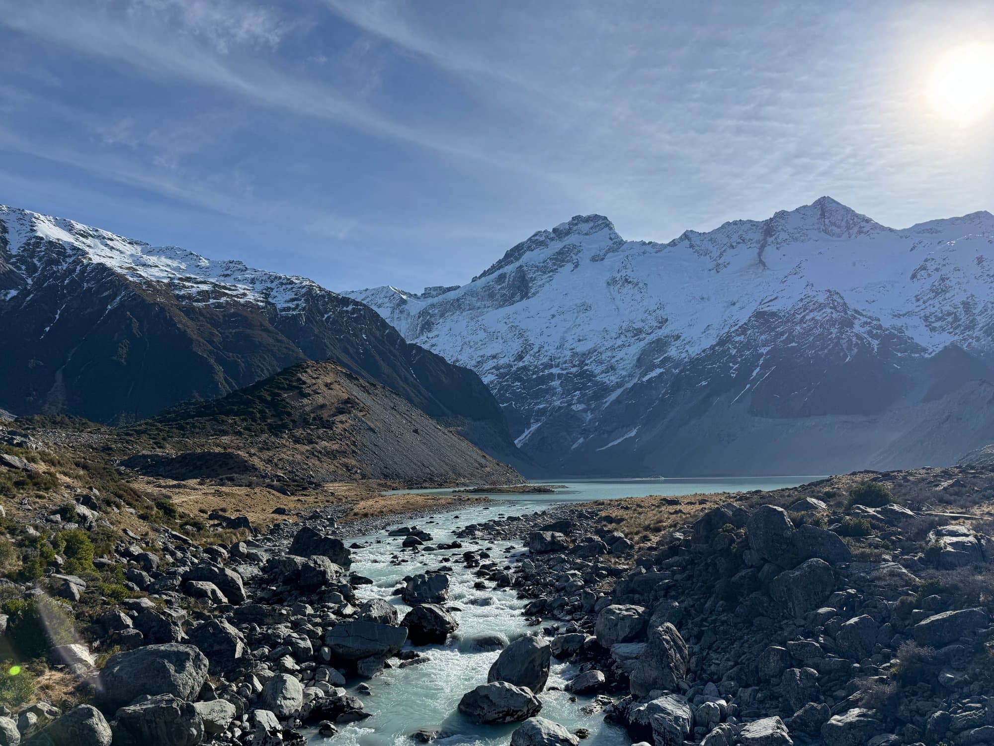Turquoise glacial lake from above at golden hour