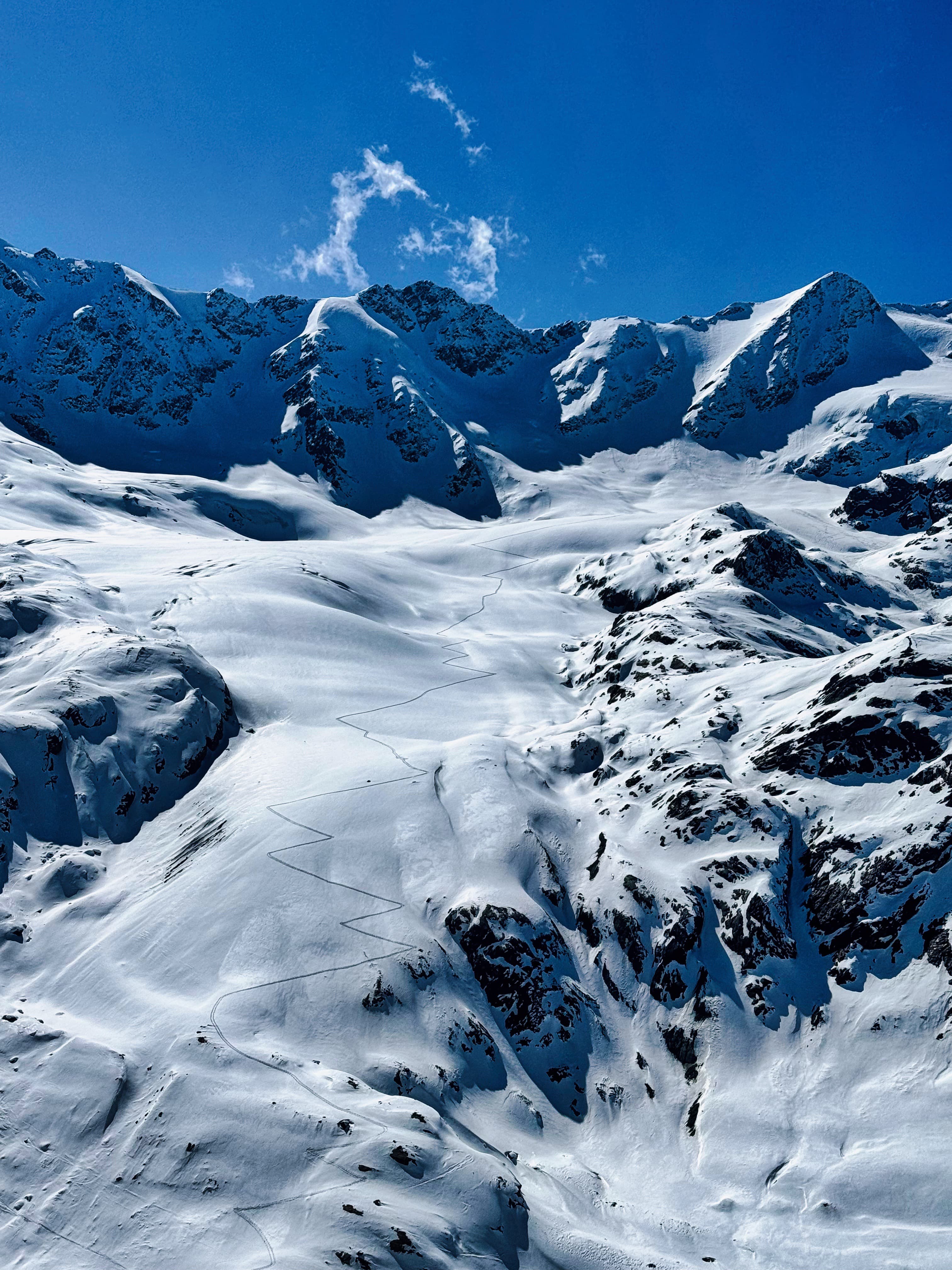 Switchback skin track carved up a steep glacier face in the Ortler Range