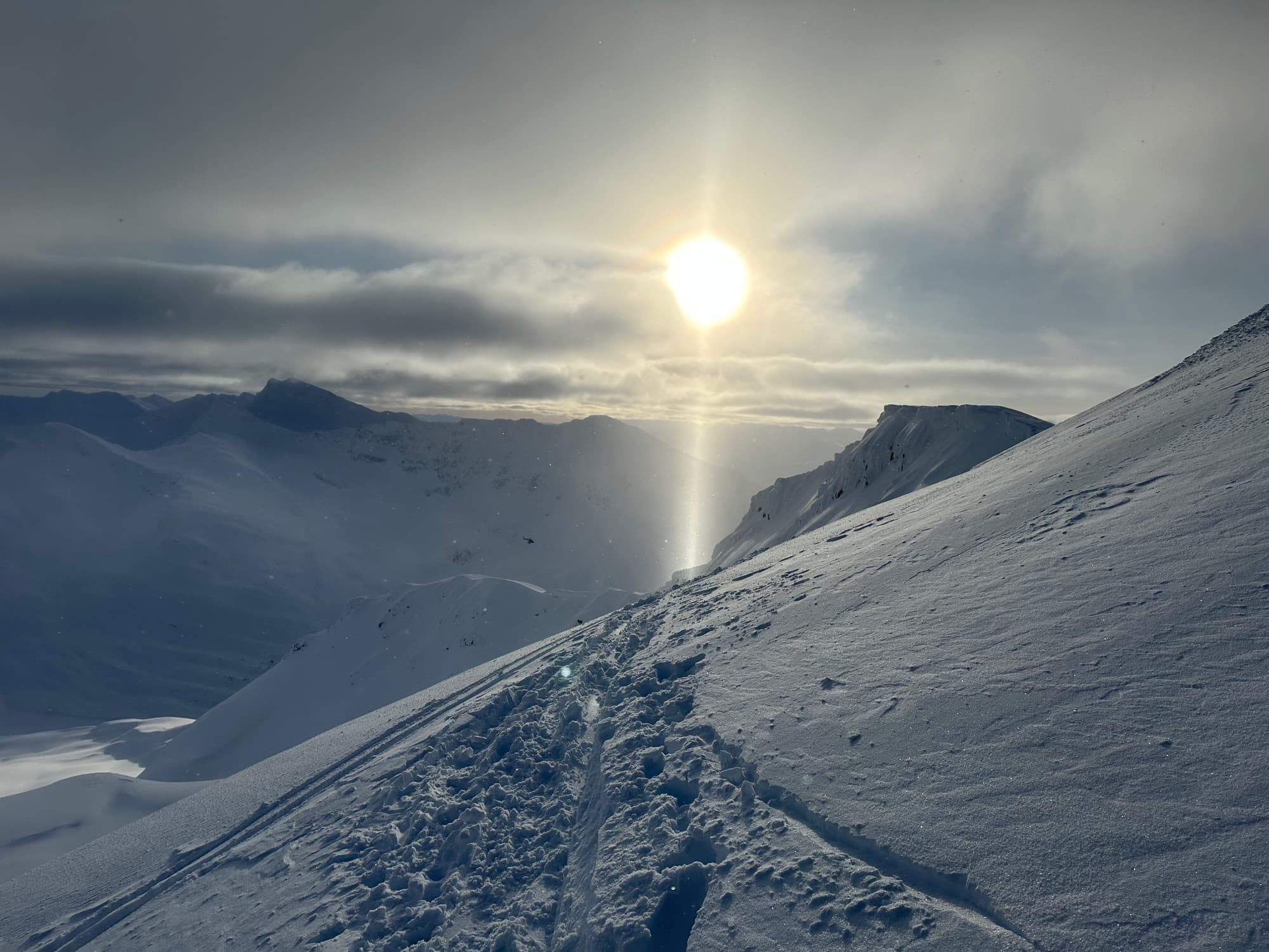 Crossing a glacier moraine with crevassed ice